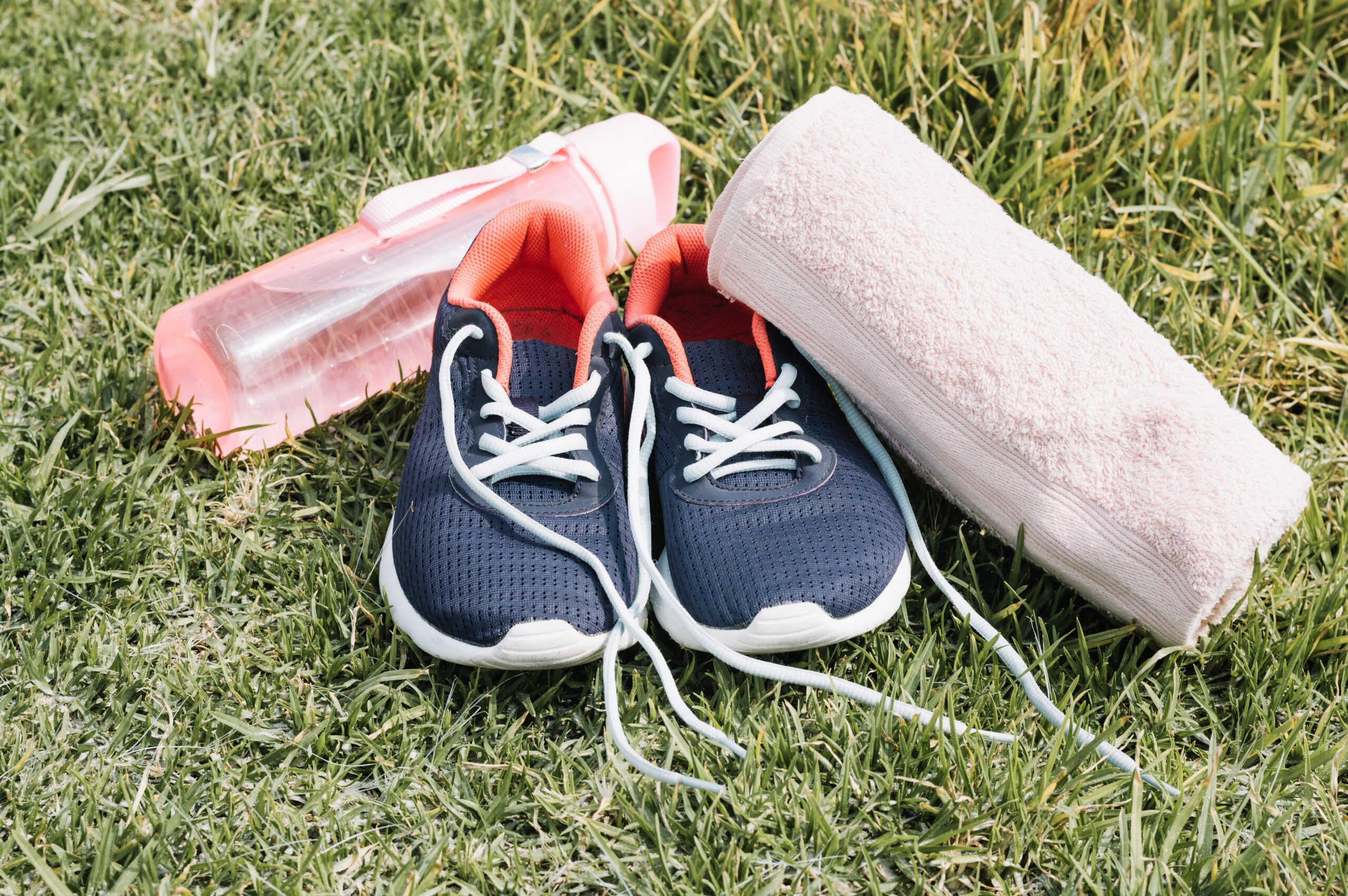 towel sneakers near bottle